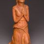 clay sculpture in prayer pose